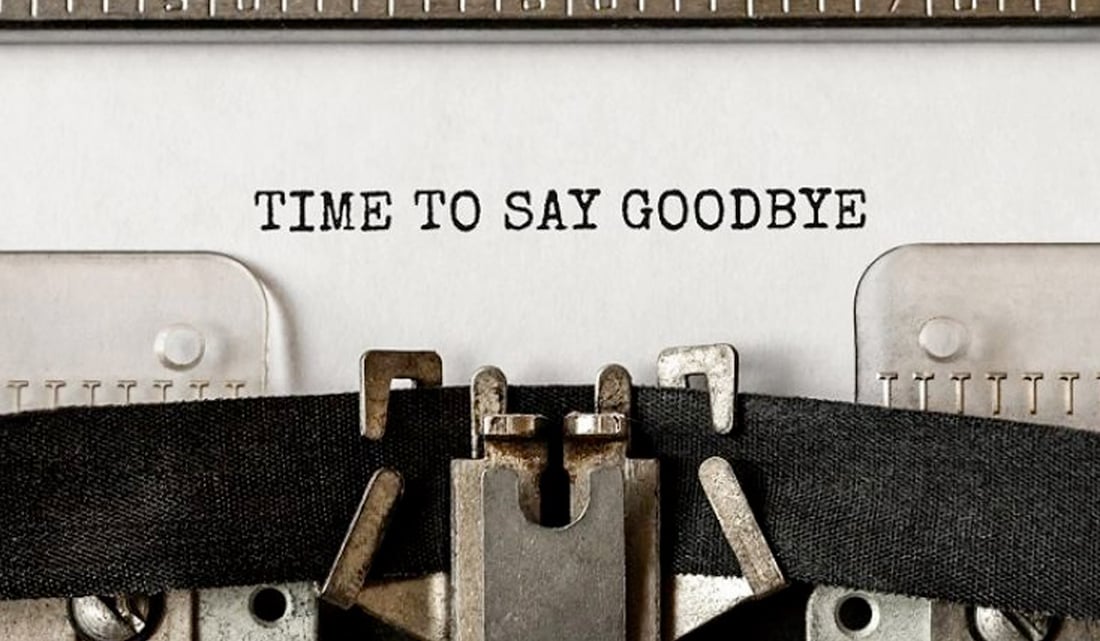 time to say goodbye text on typewriter