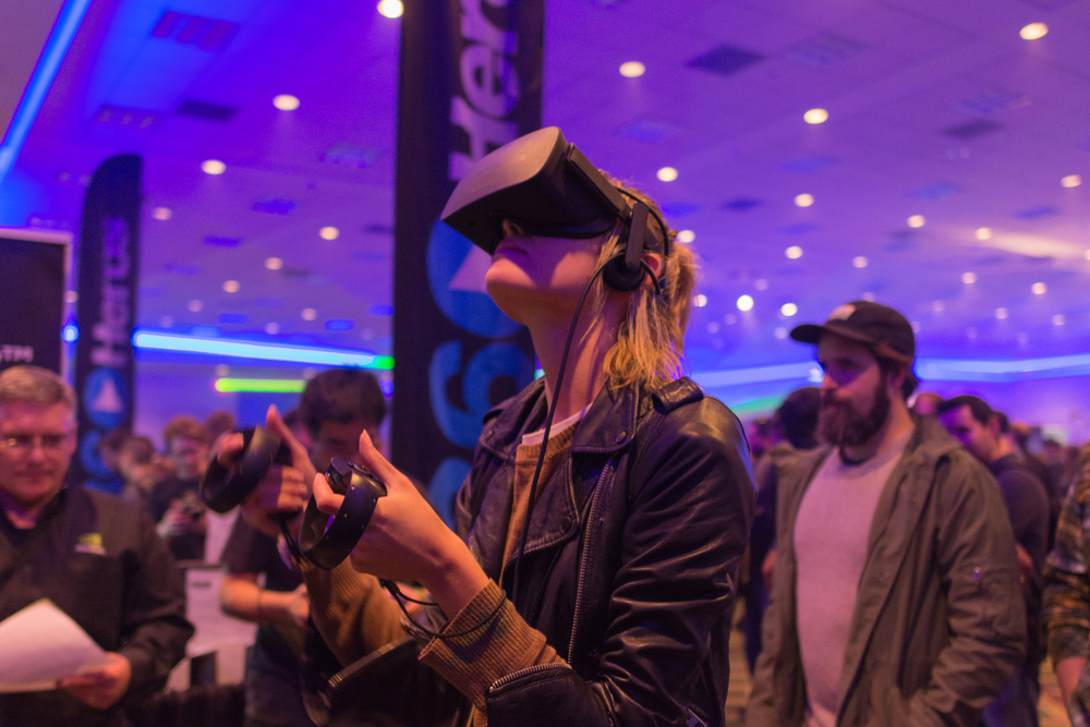 Woman tries virtual reality Samsung Gear VR headset during VRLA Expo Winter