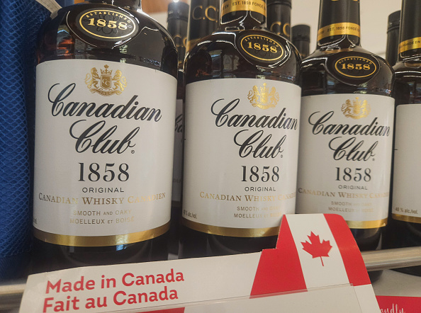 : 'Made in Canada' stickers placed next to price tags of Canadian Club Whiske