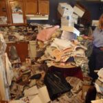 My 83-year-old mother pays her rent on time, but she’s a hoarder — her place is crammed with old newspapers and other garbage. If the condo board finds out, can her housing be taken away?