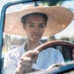 I’m 22 and want to move out of my parents’ house, but I can’t afford rent because my car payments are too high — what can I do to lower my auto and living costs?