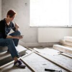 I’m an artist who makes $80K/year — but major home repairs have depleted my emergency savings. Should I pause my retirement contributions to rebuild my emergency fund?