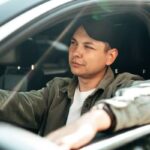 My new job has me on the road a lot. I claim mileage and get $200/month in car allowance — but I’m spending a fortune on gas. Should I buy a second, more fuel efficient car just for work?