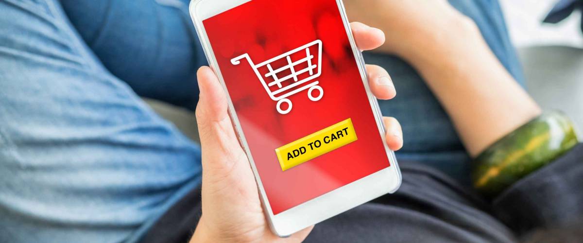 add to cart button on mobile screen with woman holding mobile phone buy online shopping item with apps,digital marketing concept.